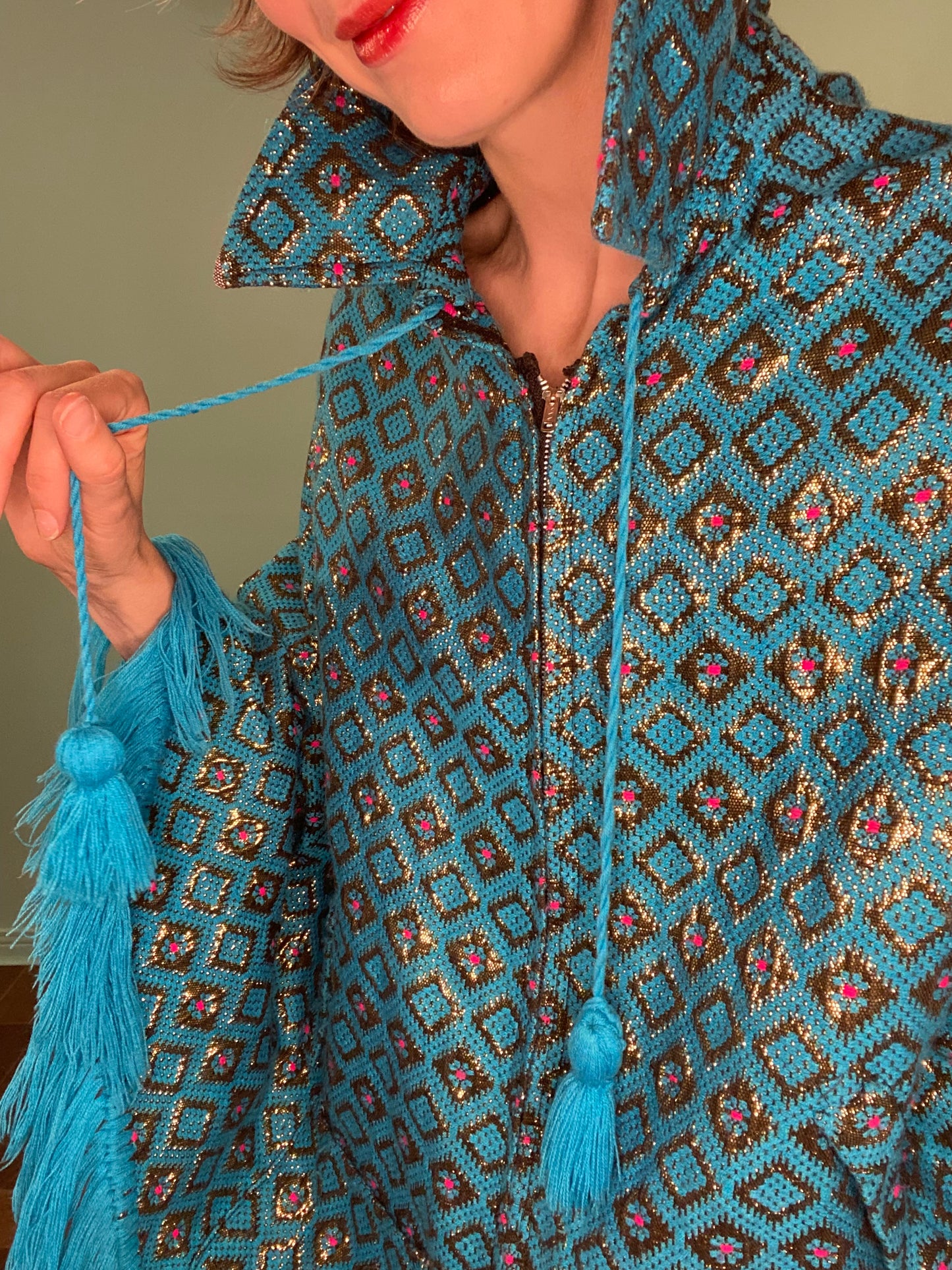 VINTAGE FRINGED TURQUOISE CAPE WITH GOLD AND PINK PATTERN