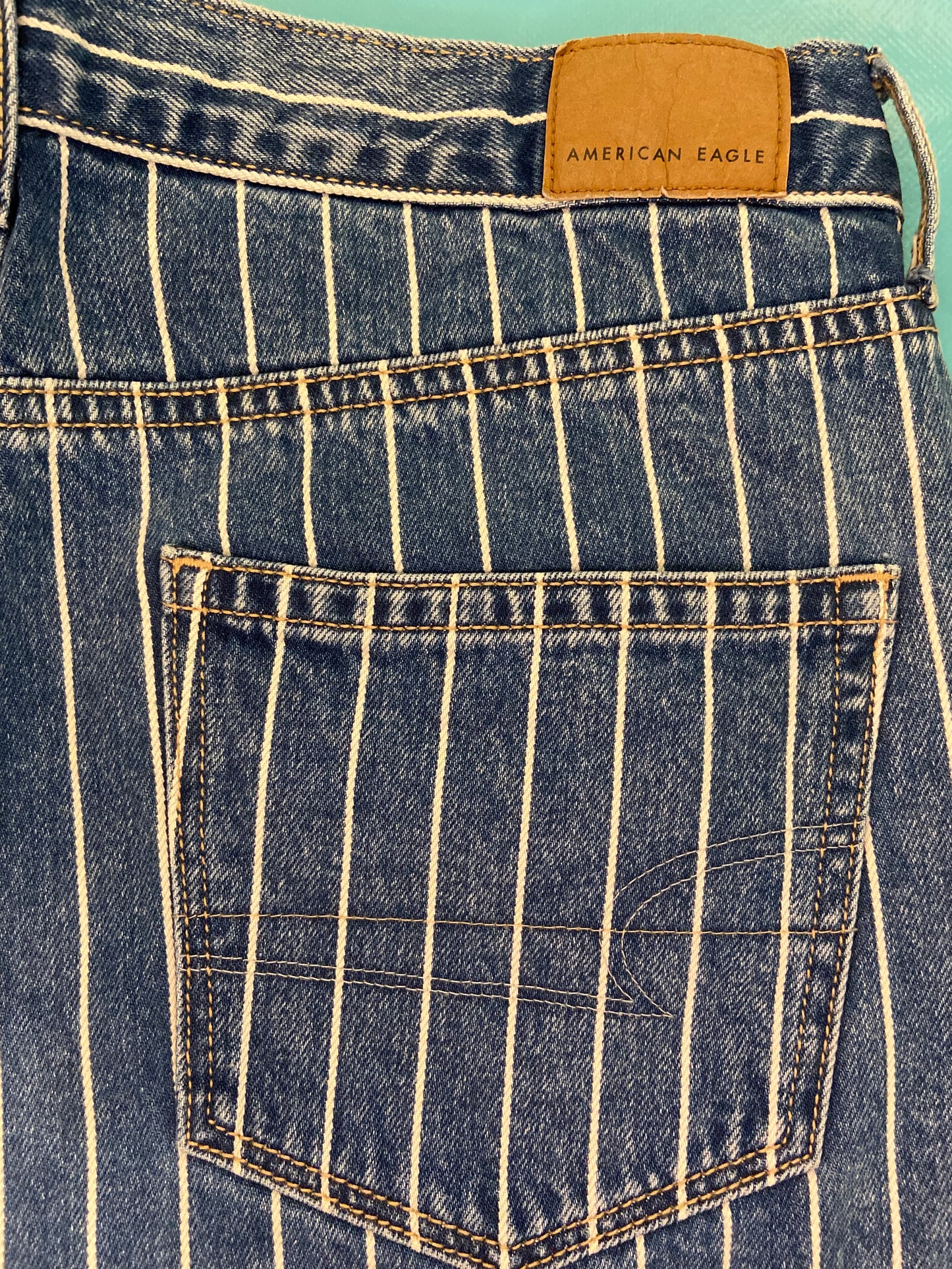 "AMERICAN EAGLE" TAPERED DARK DENIM AND WHITE PINSTRIPE JEANS